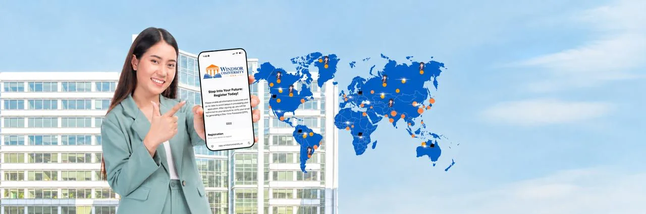 A Windsor University student shows the online registration page beside a world map
